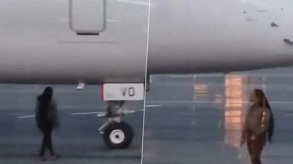 Пилоте, спри! Жена тича като обезумяла на пистата на летище ВИДЕО